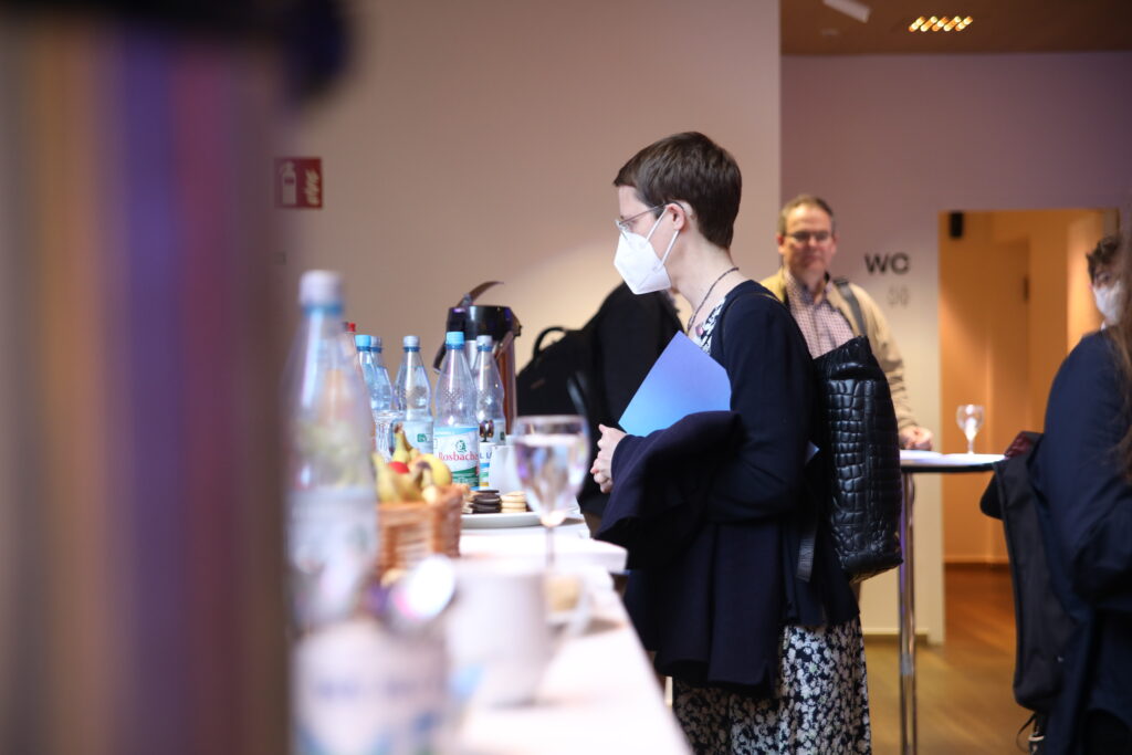 This photo shows a woman during coffee break.