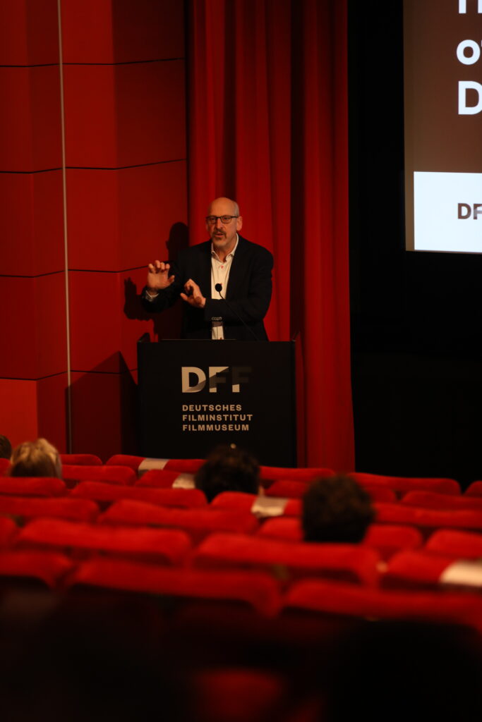 This photo shows a man giving a lecture.